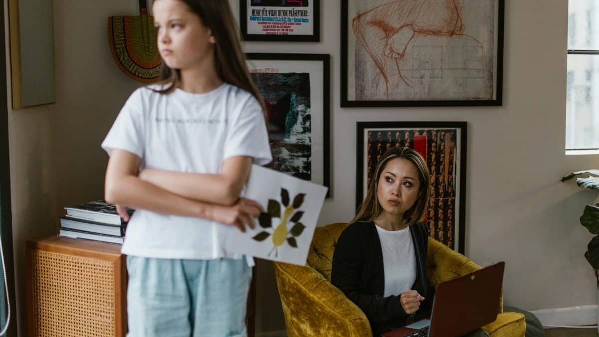 A mother and daughter share an emotional moment at home, highlighting family dynamics.