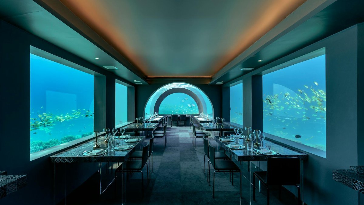 Experience fine dining at a stunning underwater restaurant in the Maldives.