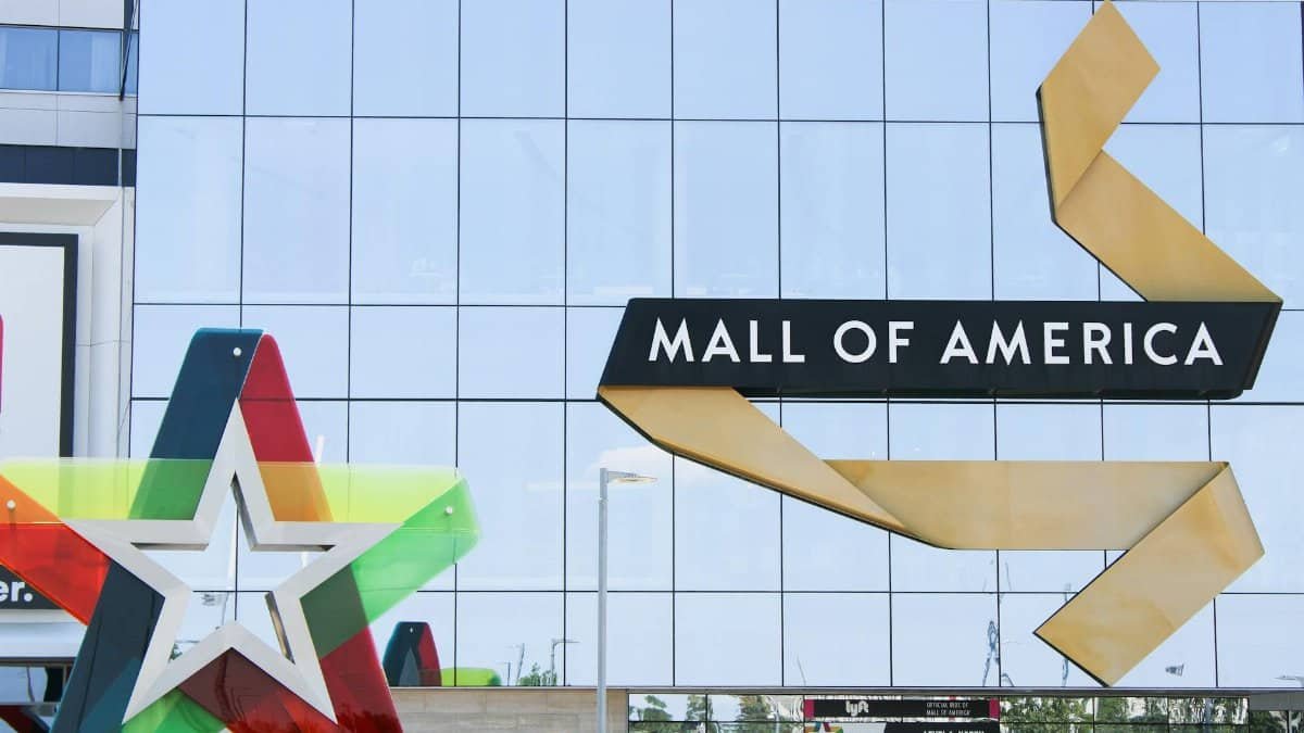 Exterior of Mall of America with glass facade and colorful star decoration in Bloomington, MN.