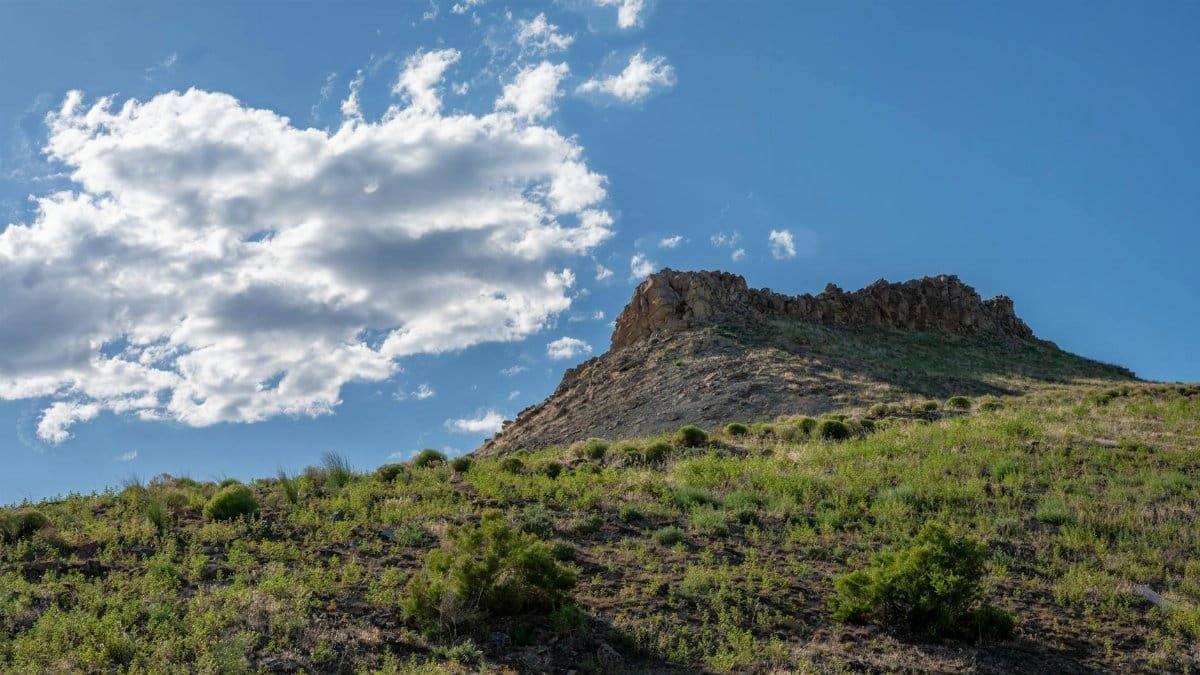 Breathtaking view of a rocky hill under a clear blue sky near Boise, Idaho.