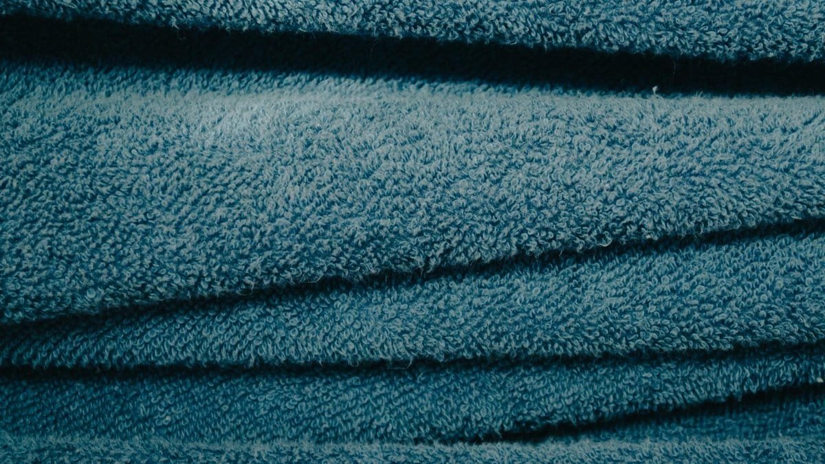 Detailed view of soft blue towels showcasing texture and fabric pattern.