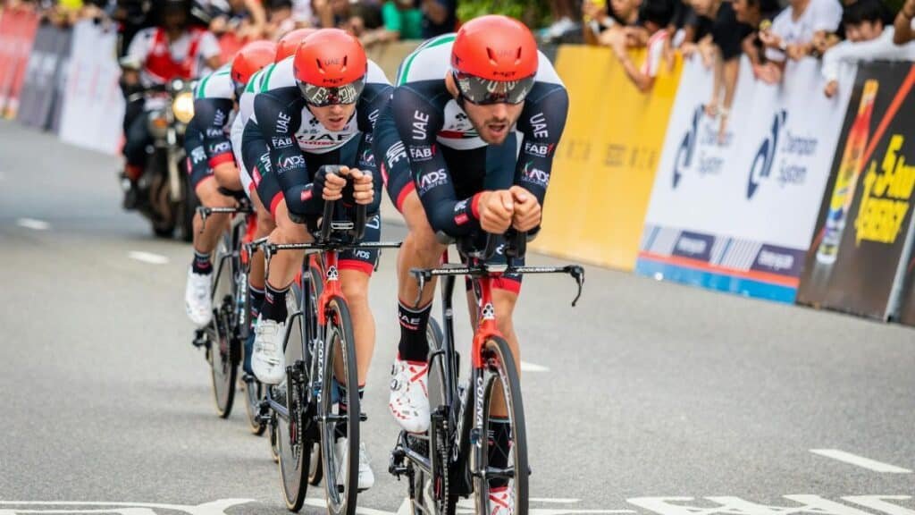 Professional cycling team competing in an outdoor race in Hong Kong, showcasing endurance and teamwork.