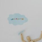 Wooden figure promoting mindfulness and breathing on a clean white background.