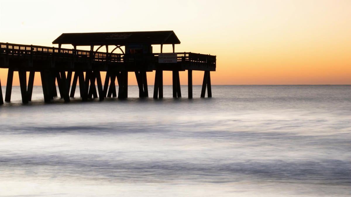 Peaceful sunset at Tybee Island Pier, Georgia capturing serene ocean views.