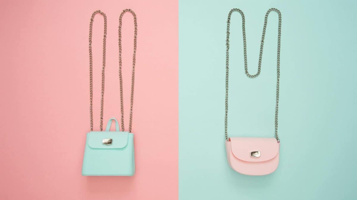 Stylish pastel handbags on pink and mint split backgrounds, perfect for fashion and design themes.