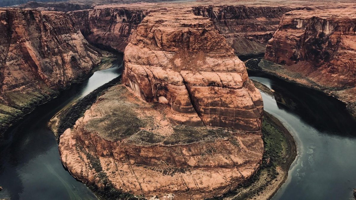 Breathtaking view of Horseshoe Bend in Page, Arizona with the Colorado River winding through the canyon.