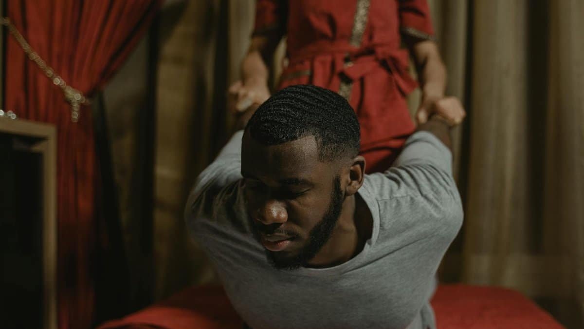 A man enjoying a therapeutic massage at a luxurious spa, enhancing relaxation and recovery.