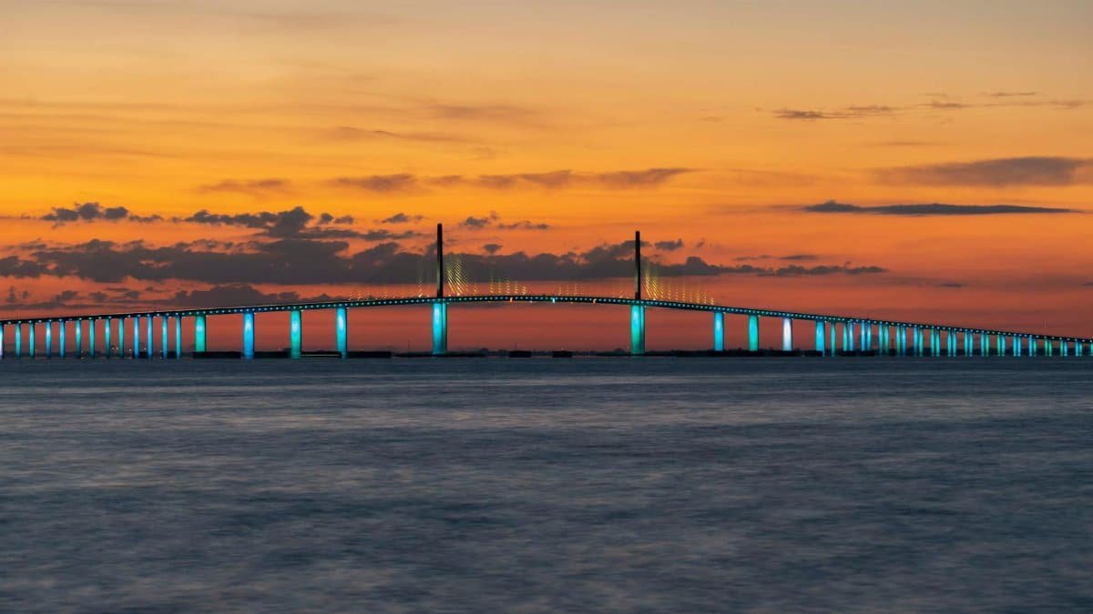 The Sunshine Skyway Bridge illuminated at sunset in St. Petersburg, Florida.