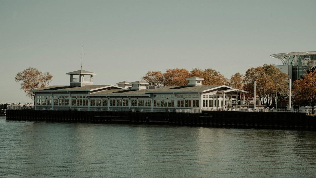Scenic view of a historic pier building in Milwaukee, Wisconsin, during fall by Lake Michigan.