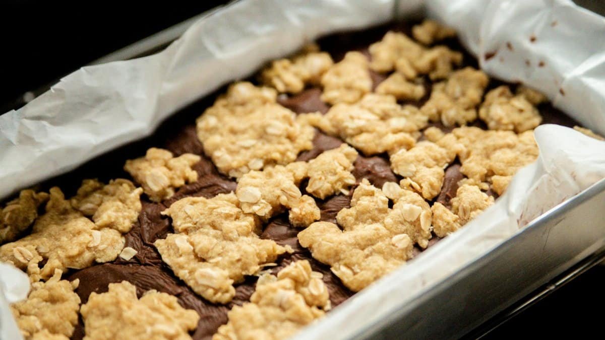 Freshly baked chocolate oatmeal bars in a tin, perfect for dessert lovers.