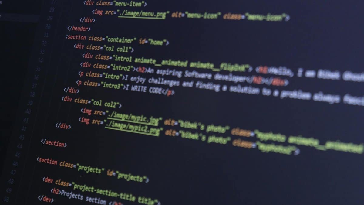 HTML and CSS code on a computer monitor, highlighting web development and programming.