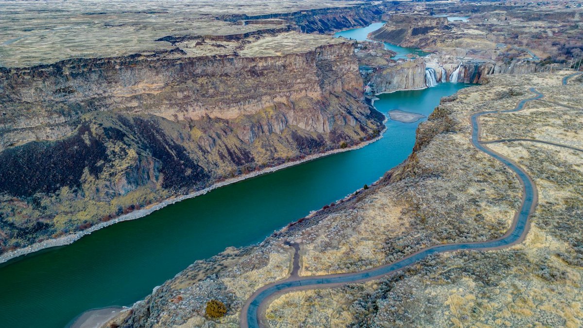 Stunning aerial view of Snake River winding through rocky Twin Falls Canyon in Idaho, USA.