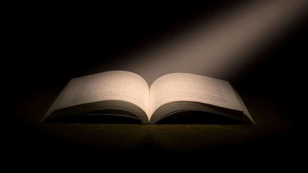 A captivating image of an open book under a dramatic spotlight, symbolizing knowledge.