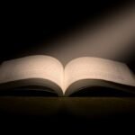 A captivating image of an open book under a dramatic spotlight, symbolizing knowledge.