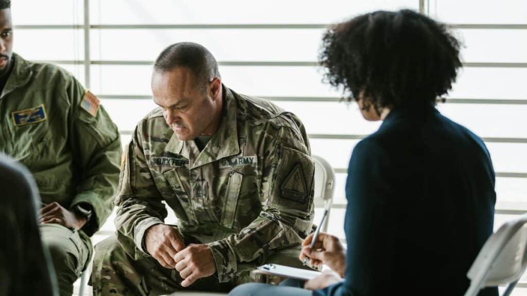 A therapy session for military veterans focusing on mental health and PTSD support.