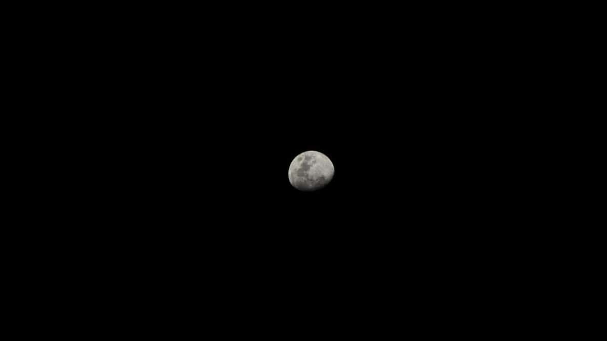 Captivating image of the moon against a stark black sky, highlighting lunar details.