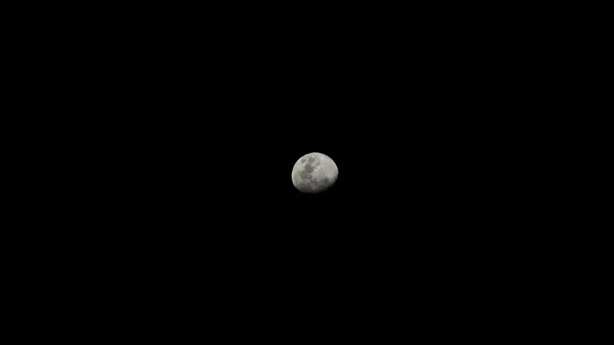 Captivating image of the moon against a stark black sky, highlighting lunar details.