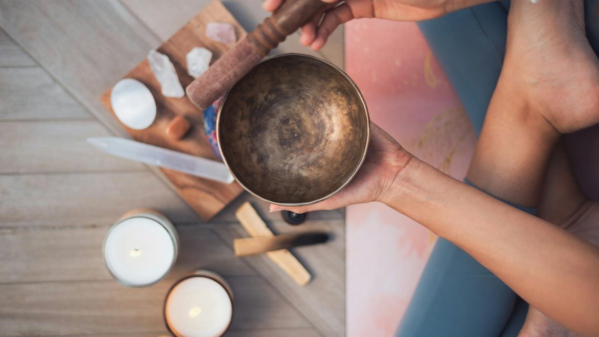 Experience tranquility with a Tibetan singing bowl and meditation setup, enhancing your spiritual practice.