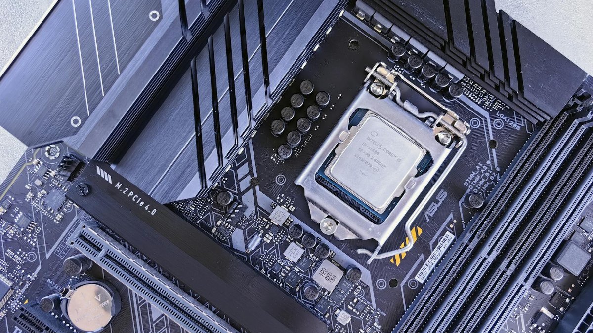 High-quality image showcasing a computer motherboard with an installed CPU chip in focus.