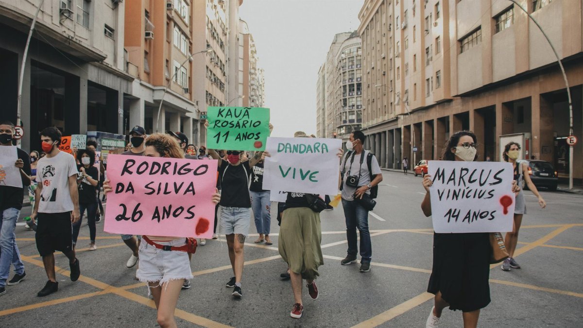 A group of activists peacefully protesting for justice and equality on the streets of Rio de Janeiro.