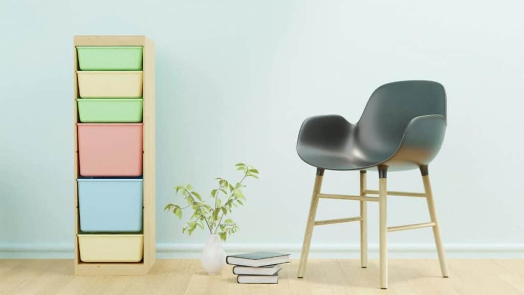 Modern minimalist interior featuring a stylish chair and a colorful storage unit.