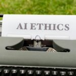 A vintage typewriter outdoors displaying "AI ethics" on paper, symbolizing tradition meets technology.