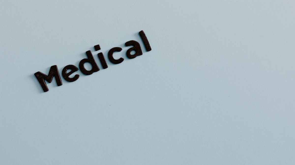 Simple typography of the word 'Medical' on a light background conveys healthcare concept.