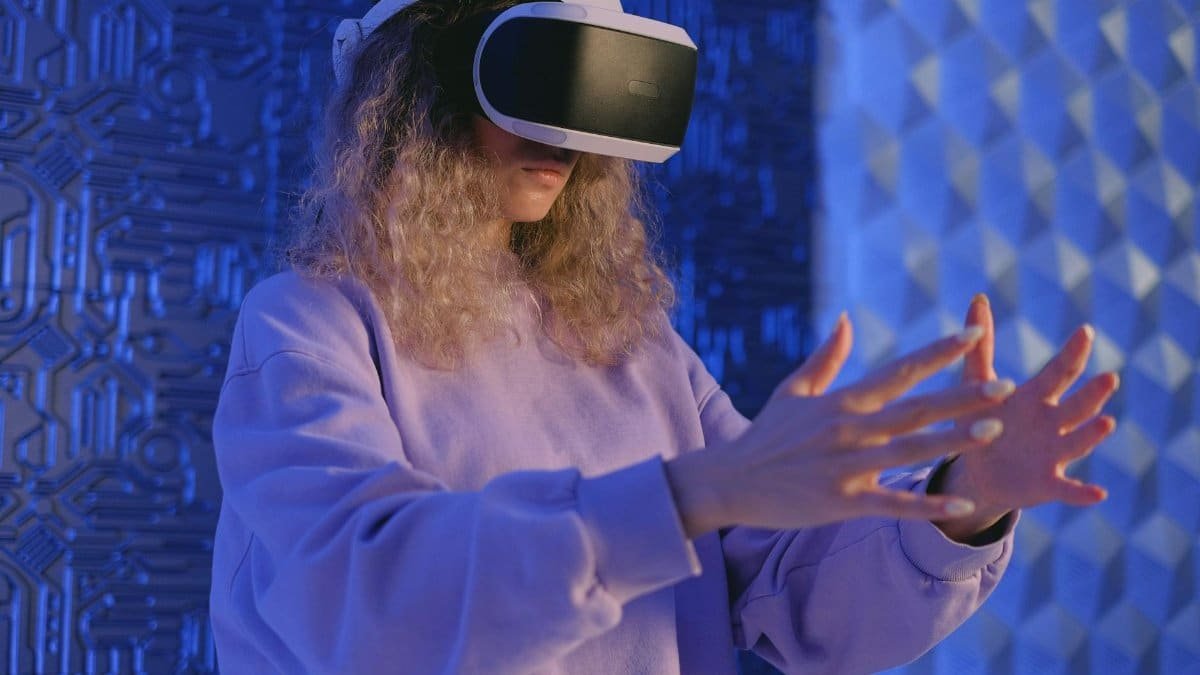 Woman experiencing virtual reality immersed in a futuristic setting with VR headset.