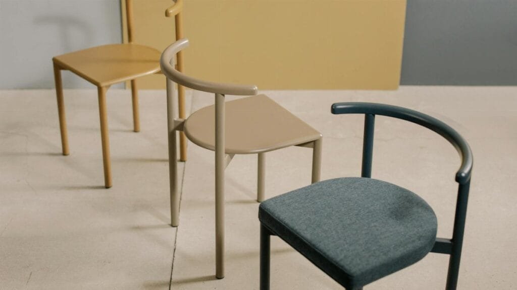 Three stylish chairs showcasing minimalist design and soft colors perfect for contemporary spaces.