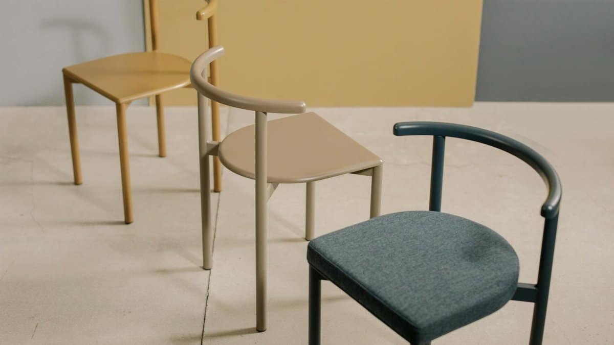 Three stylish chairs showcasing minimalist design and soft colors perfect for contemporary spaces.