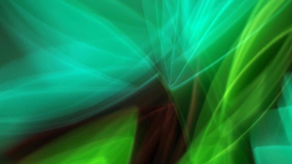 Vibrant abstract artwork featuring flowing green and blue light trails.