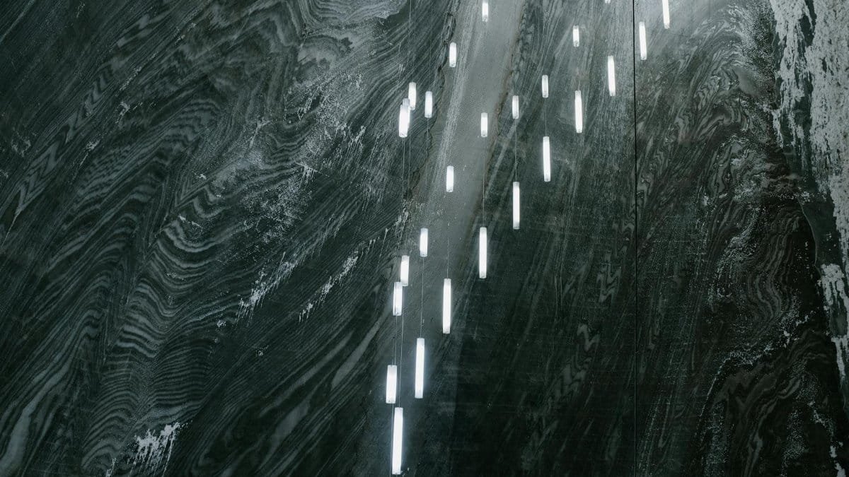 A visually stunning view inside a salt mine in Romania, showcasing illuminated textured walls.