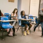 Students in a classroom experiencing a bullying situation among peers.