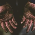 Close-up of dirty hands representing hard work and labor in Frankfurt.