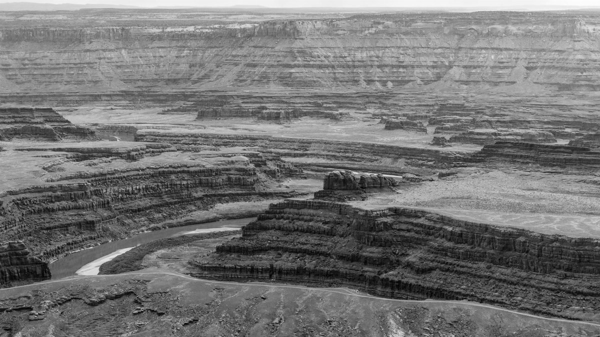 A dramatic black and white landscape of the iconic Colorado River canyon in Dead Horse Point, Utah.
