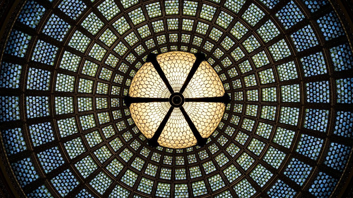 A mesmerizing view of the Tiffany stained glass dome at Chicago Cultural Center.
