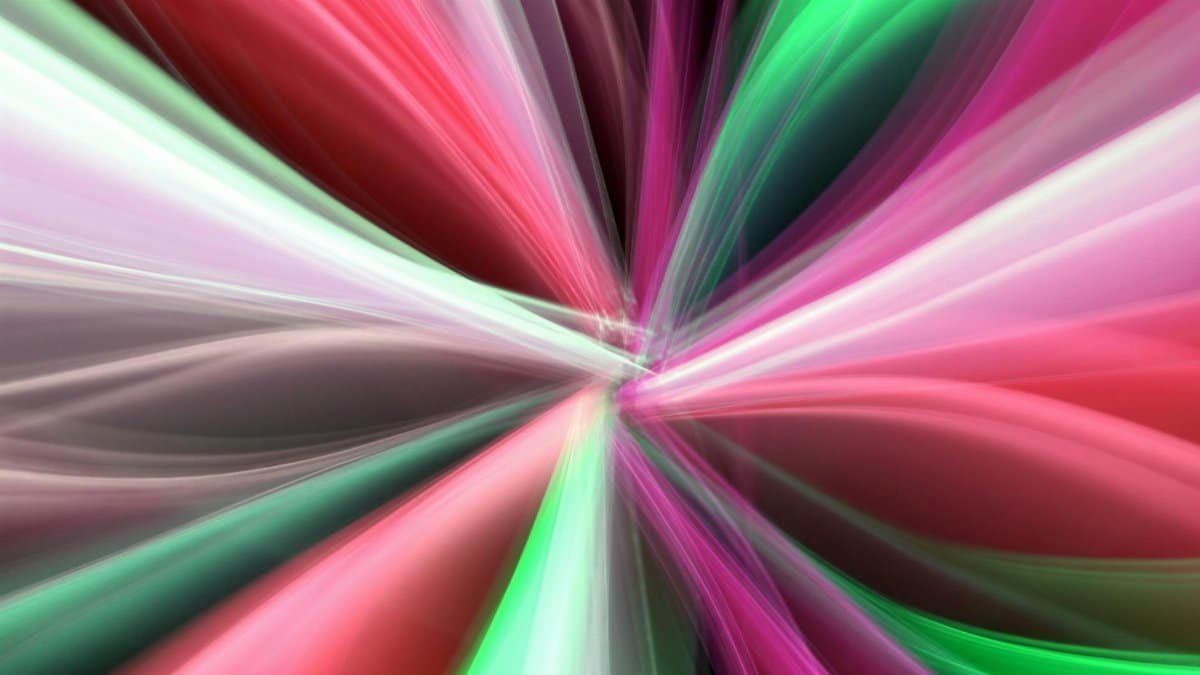 Colorful abstract light streaks create a dynamic motion effect, offering a vibrant and energetic visual experience.