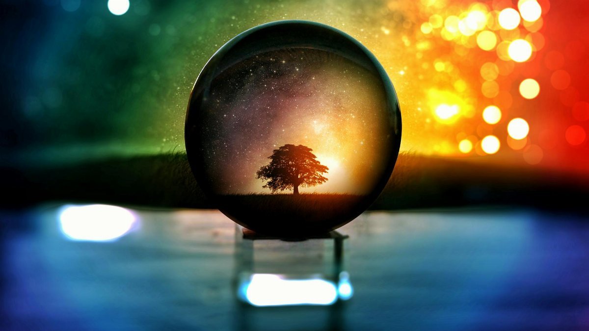 A mesmerizing scene of a tree and stars in a crystal ball with vibrant bokeh lights.