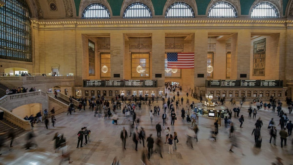 A lively scene inside Grand Central Terminal, New York with people in motion.
