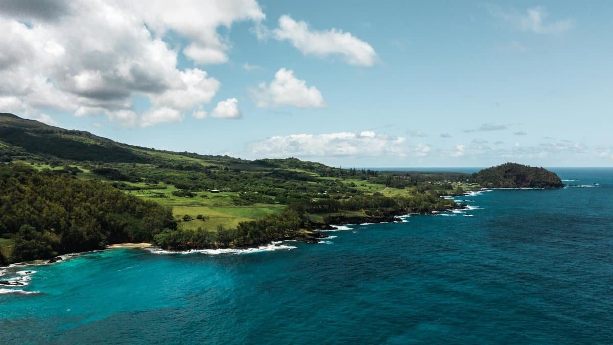 A breathtaking aerial view of the lush green coastline near Hana, Maui, Hawaii.