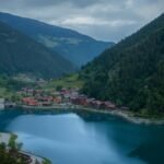 Picturesque view of Uzungöl Lake surrounded by lush mountains in Trabzon, Turkey.