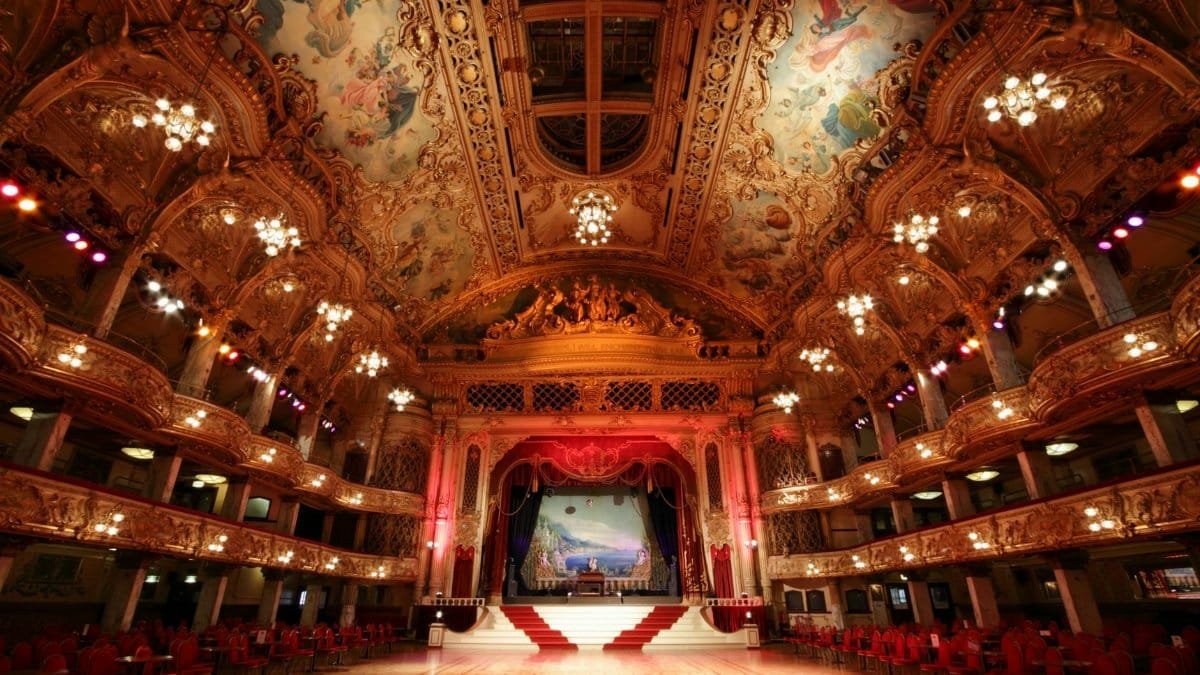 Stunning view of the historic Blackpool Tower Ballroom's ornate interior with elegant chandeliers and detailed ceiling artwork.