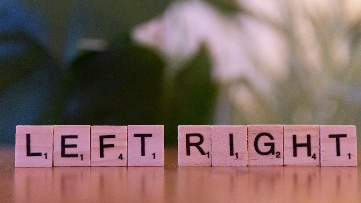 Scrabble tiles spelling 'left' and 'right' on a wooden surface with blurred background.