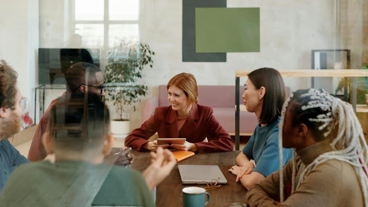 A multicultural team collaborates in a modern office, fostering creativity and teamwork.