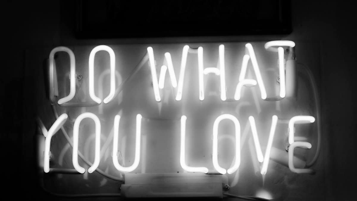 Monochrome neon sign with inspiring message 'Do What You Love' in Riga, Latvia.