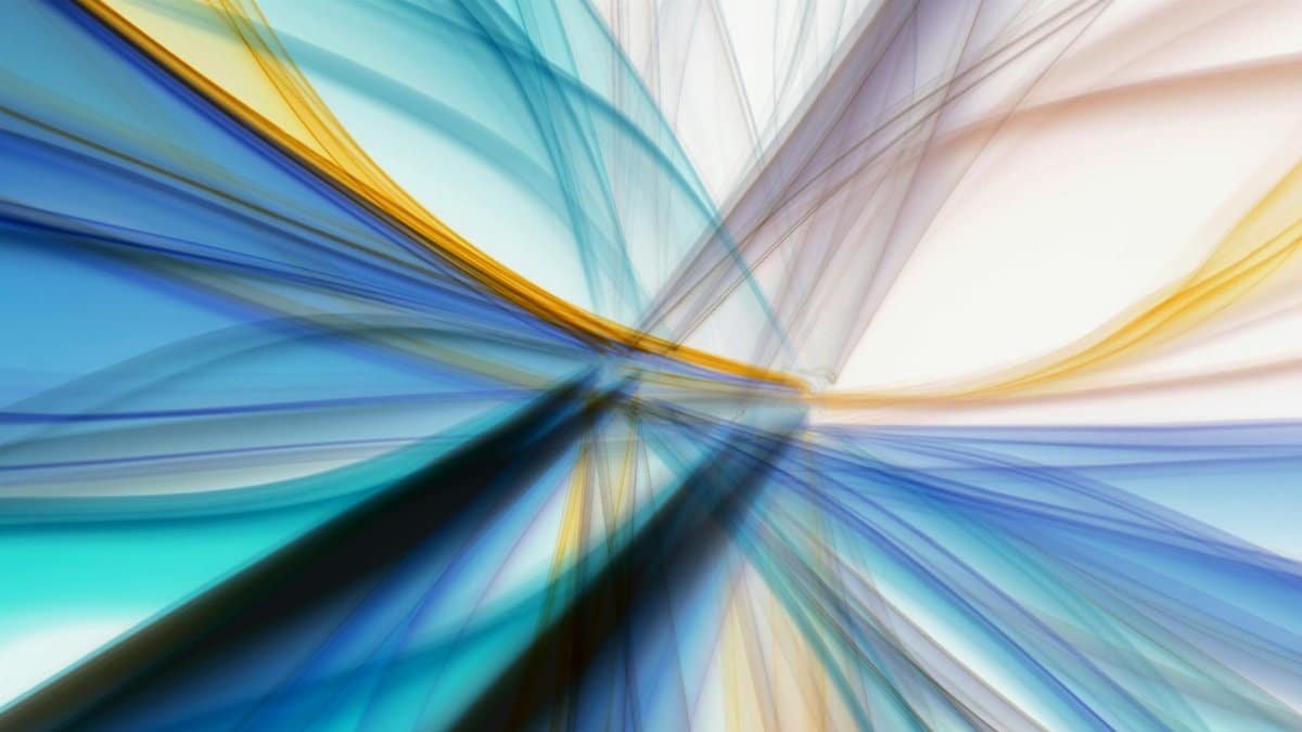 Dynamic abstract art featuring vivid blue and yellow light streaks creating an energetic visual flow.
