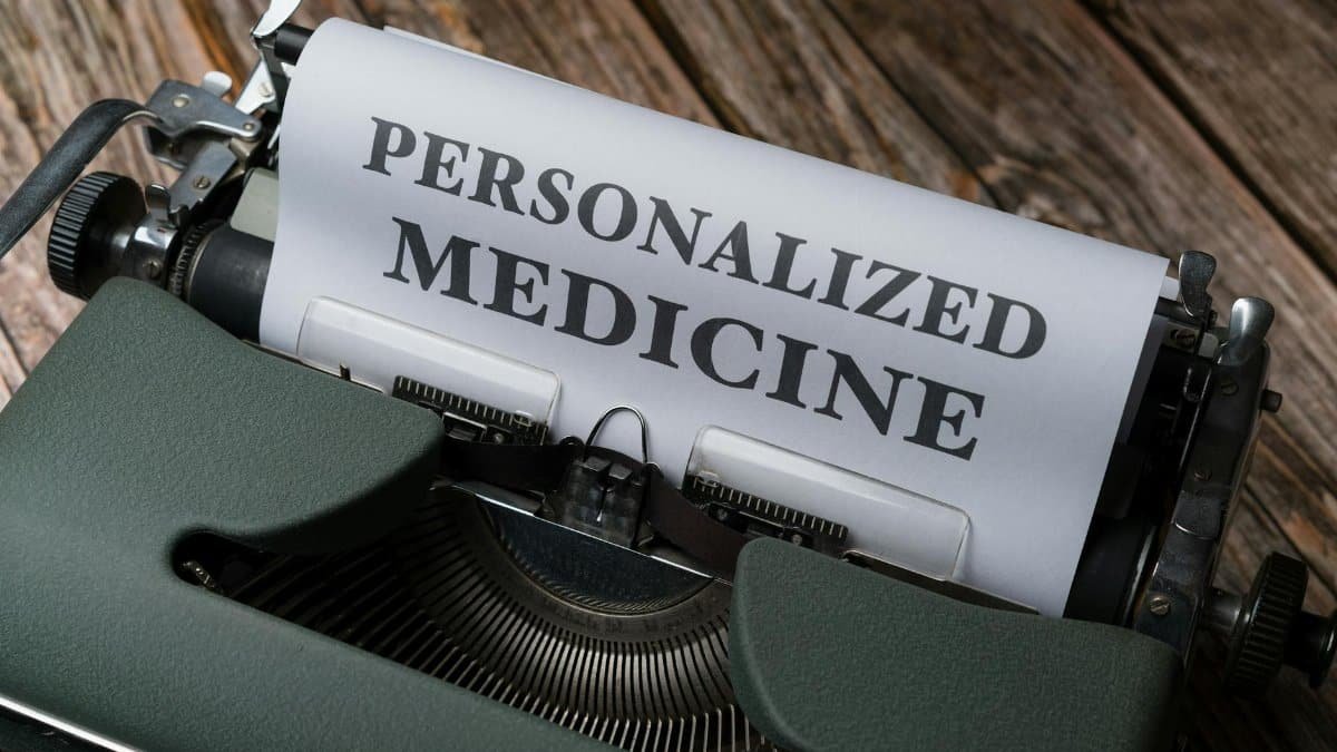 Close-up of a vintage typewriter with paper displaying 'Personalized Medicine' text.