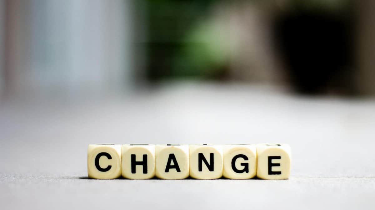 Close-up of letter blocks spelling 'CHANGE', symbolizing transformation and growth.