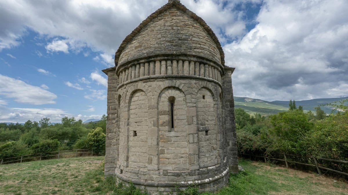 Explore the ancient round tower in Huesca, Aragon under a dynamic sky.