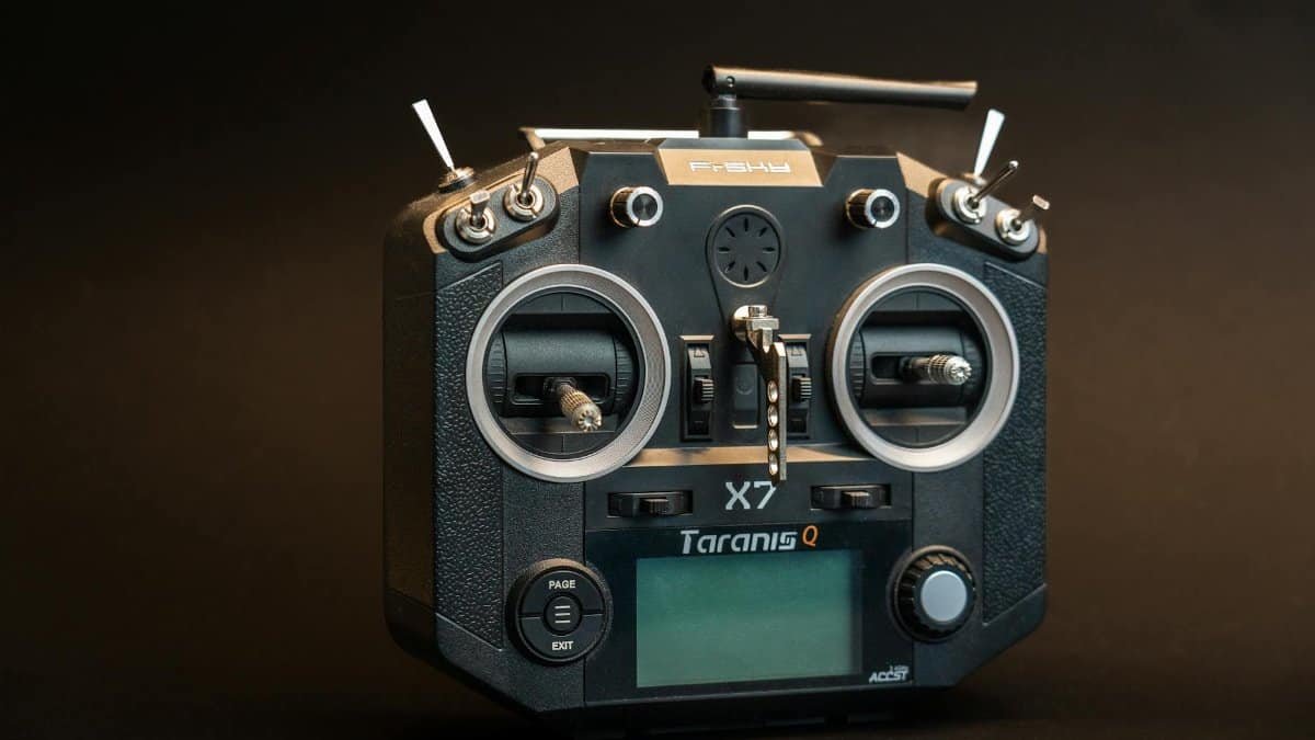 Black Taranis Q X7 drone controller with buttons and screen in a studio shot.
